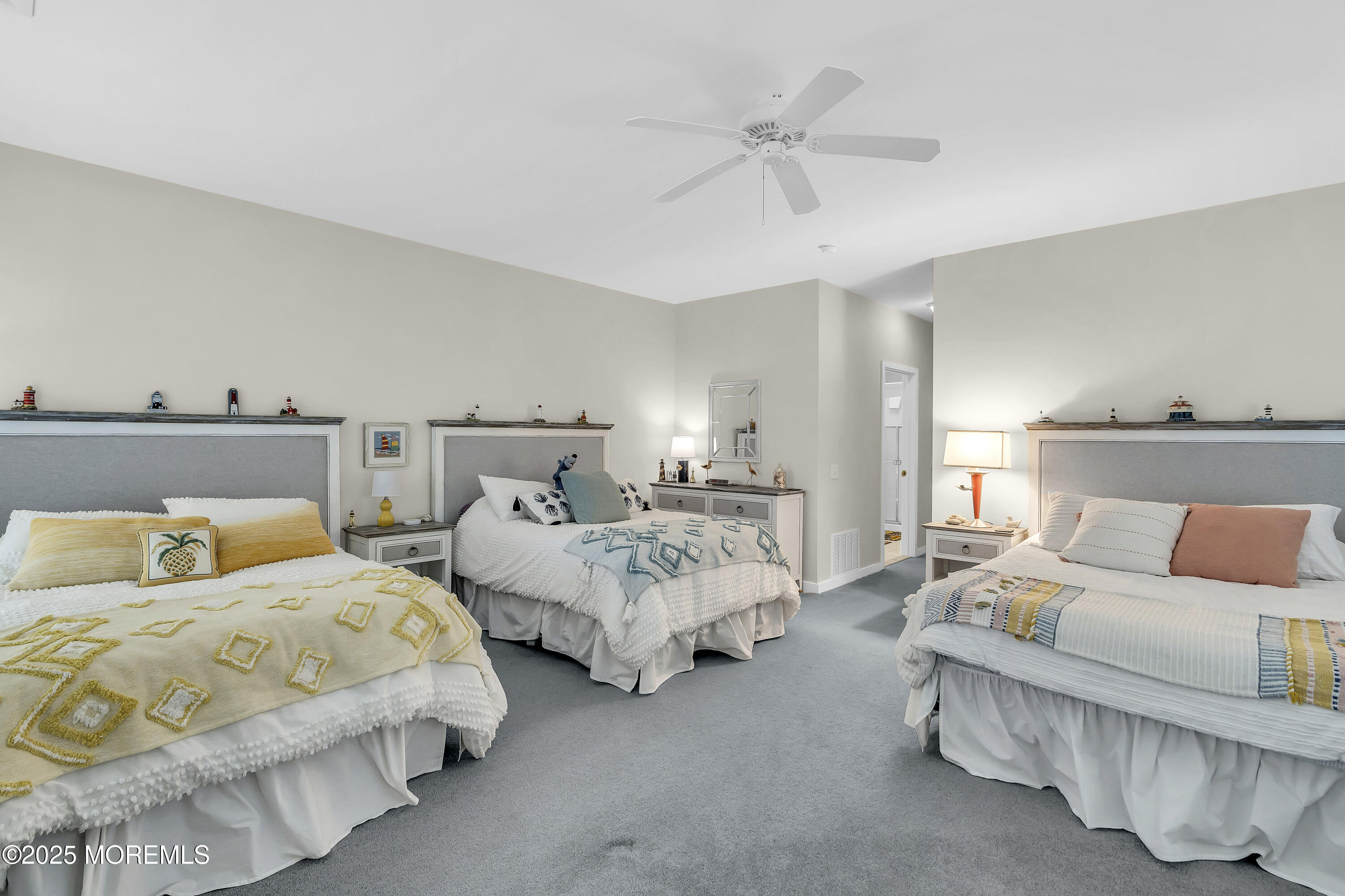 209 Beach Front, Unit 1 Manasquan, NJ 08736 - Photo 23 of 40 a bed room with two bed and a couch