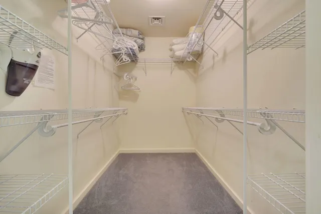 a bathroom with a double vanity sink toilet and a mirror