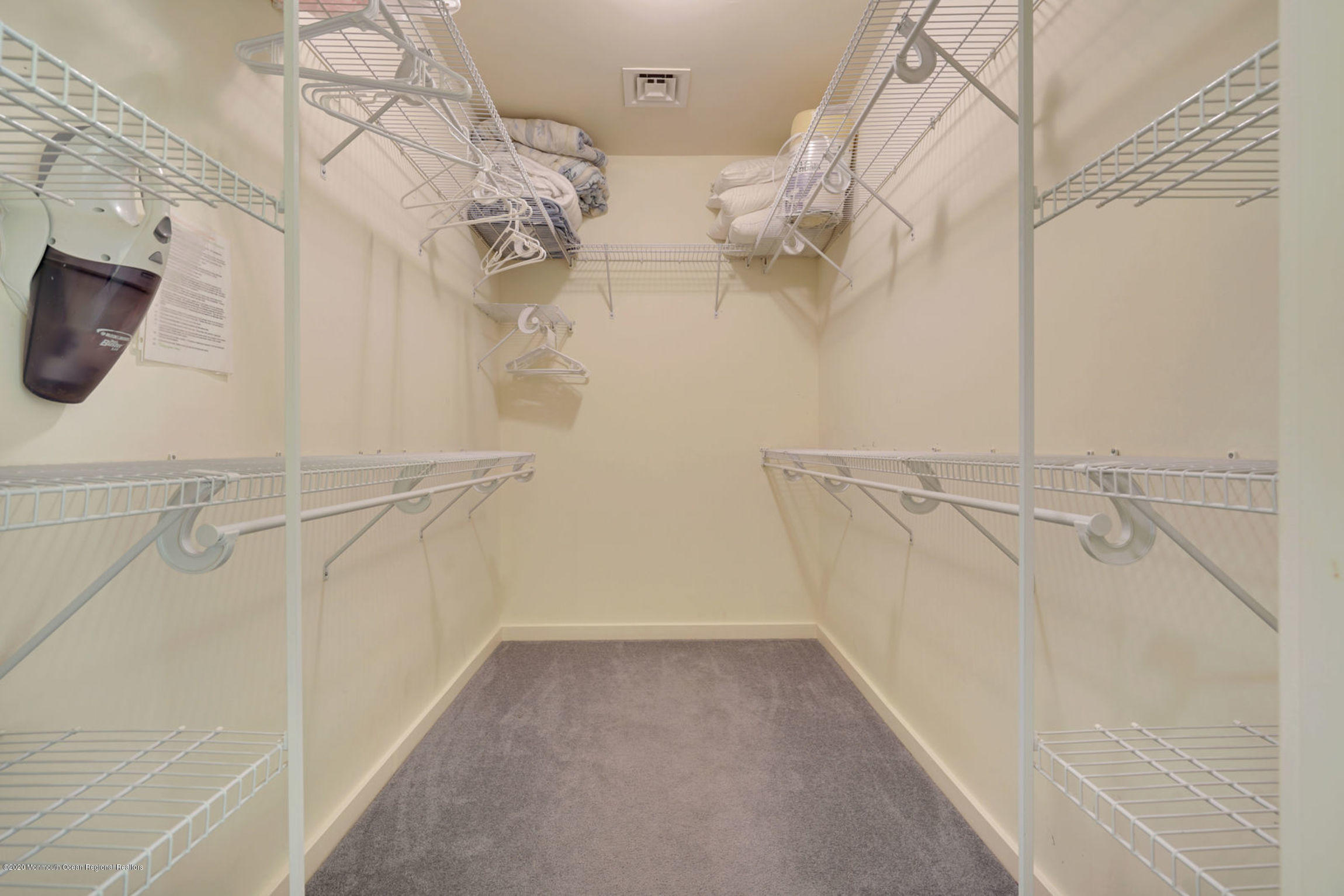 209 Beach Front, Unit 1 Manasquan, NJ 08736 - Photo 24 of 40 a view of a room with racks on the wall