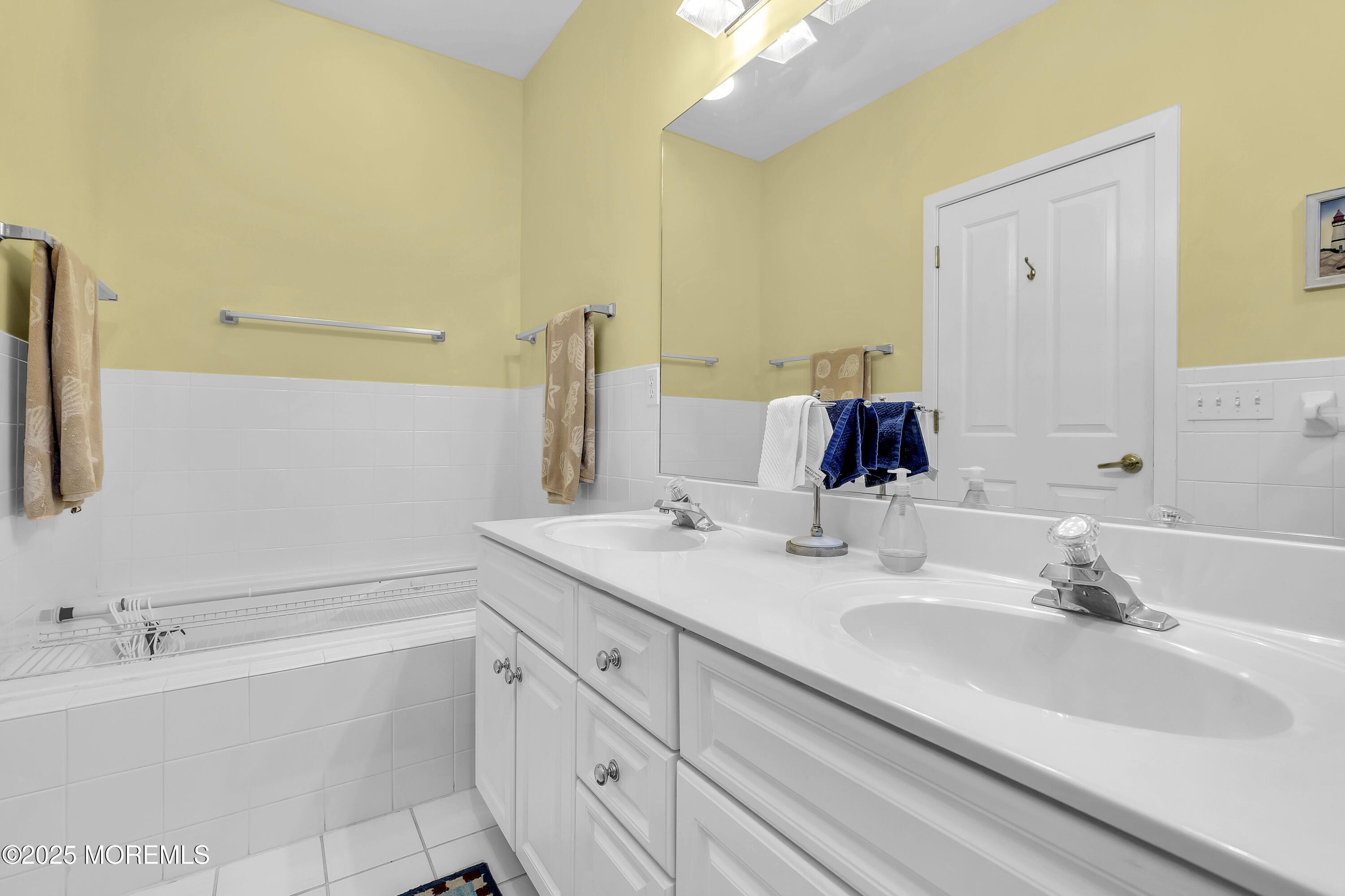 209 Beach Front, Unit 1 Manasquan, NJ 08736 - Photo 26 of 40 a bathroom with a bathtub and a sink