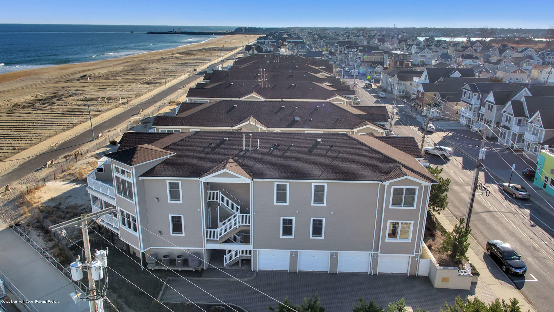 209 Beach Front, Unit 1 Manasquan, NJ 08736 - Photo 30 of 40 an aerial view of residential houses with outdoor space