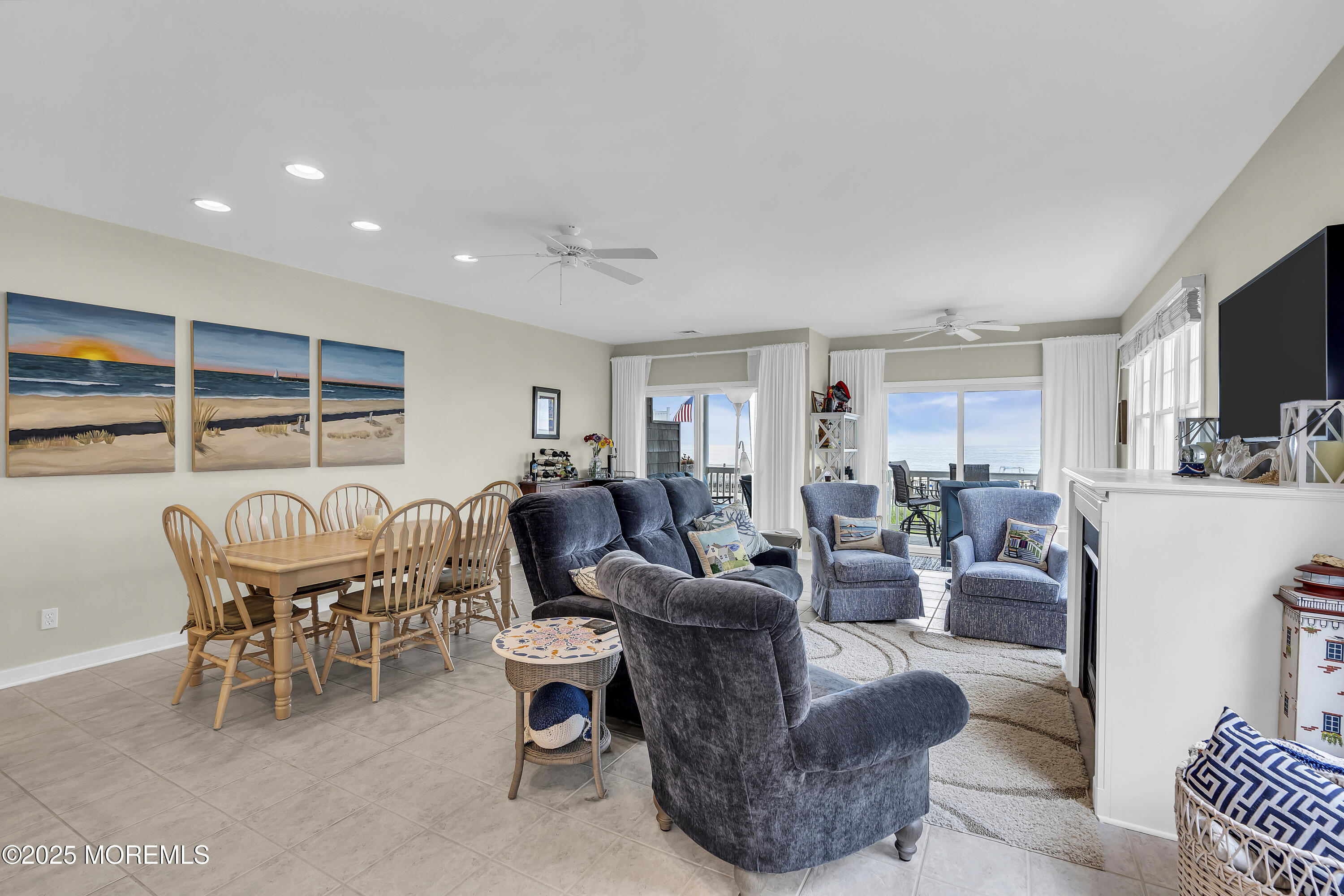 209 Beach Front, Unit 1 Manasquan, NJ 08736 - Photo 3 of 40 a living room with furniture kitchen view and a large window