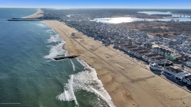 an aerial view of residential building and ocean