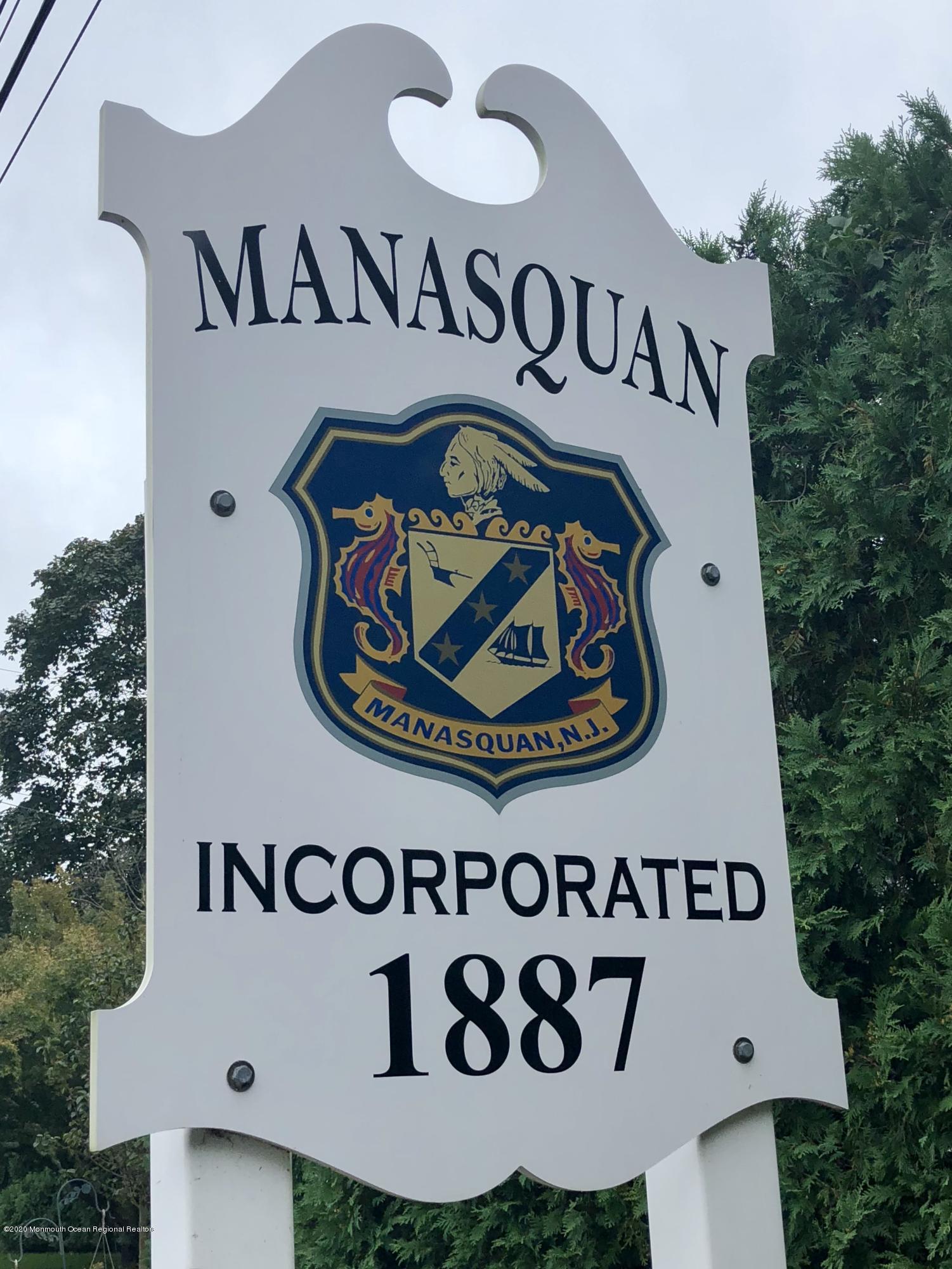 209 Beach Front, Unit 1 Manasquan, NJ 08736 - Photo 35 of 40 a sign broad on a wall