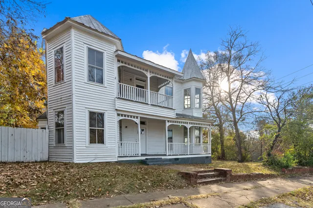 a view of entryway with wooden floor and stairs