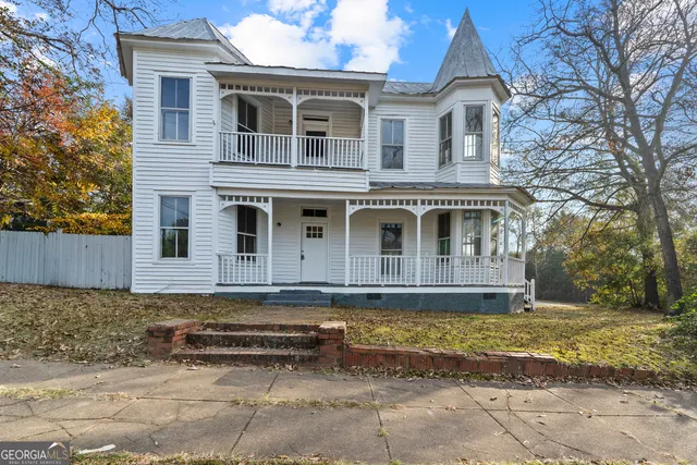 a view of entryway with wooden floor and stairs