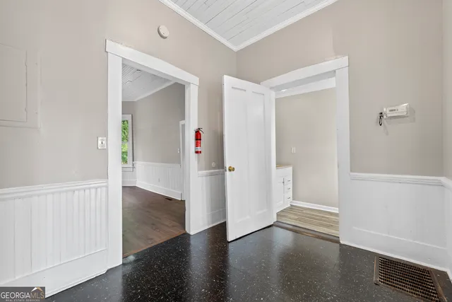 a kitchen with a refrigerator and a stove top oven