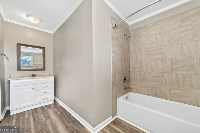 a view of entryway and hall with wooden floor