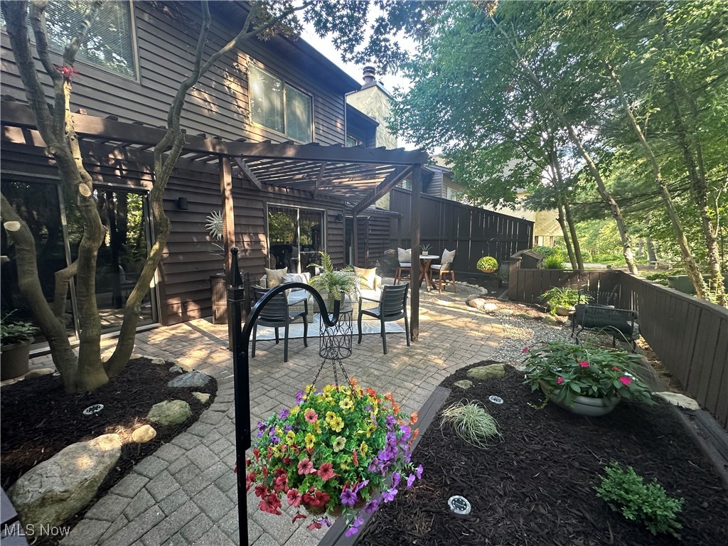 565 Hampton Ridge Drive Akron, OH 44313 - Photo 2 of 24 PRIVATE FULLY FENCED COURTYARD WITH WOODED VIEWS.