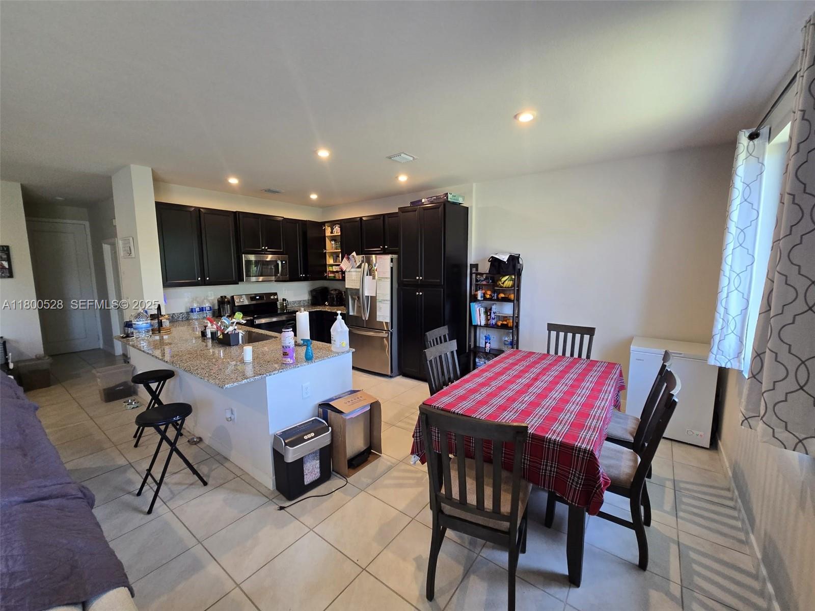 10847 Southwest 232nd Terrace Homestead, FL 33032 - Photo 11 of 29 a view of a dining room with furniture
