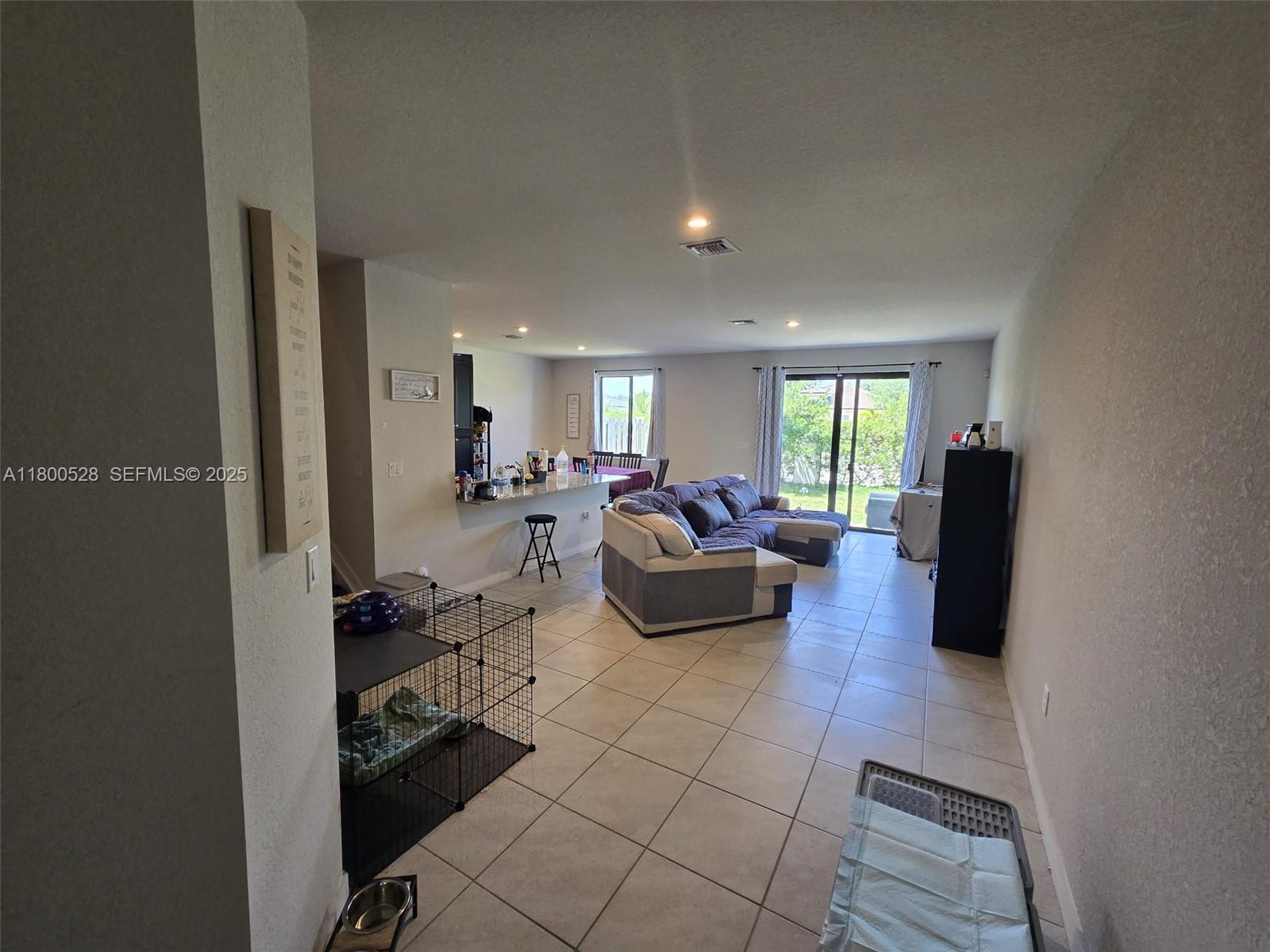 10847 Southwest 232nd Terrace Homestead, FL 33032 - Photo 12 of 29 a living room with furniture and a couch