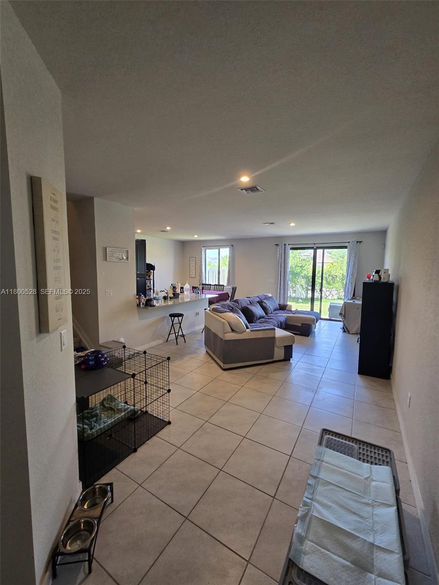 10847 Southwest 232nd Terrace Homestead, FL 33032 - Photo 13 of 29 a living room with furniture and a couch