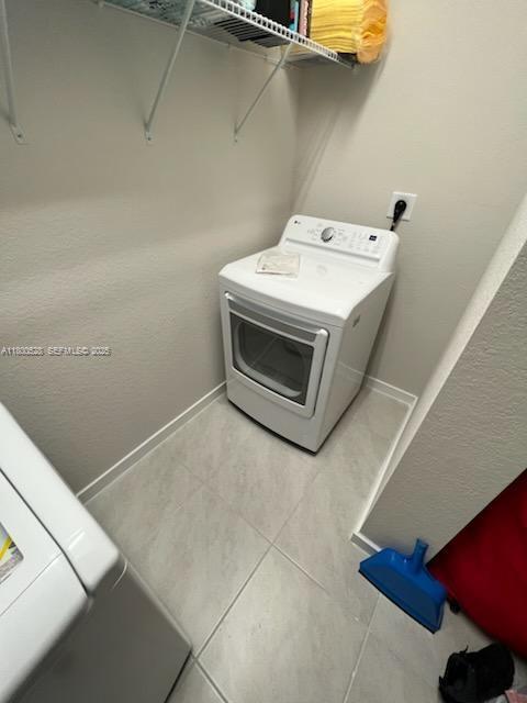 10847 Southwest 232nd Terrace Homestead, FL 33032 - Photo 14 of 29 a utility room with dryer and washer