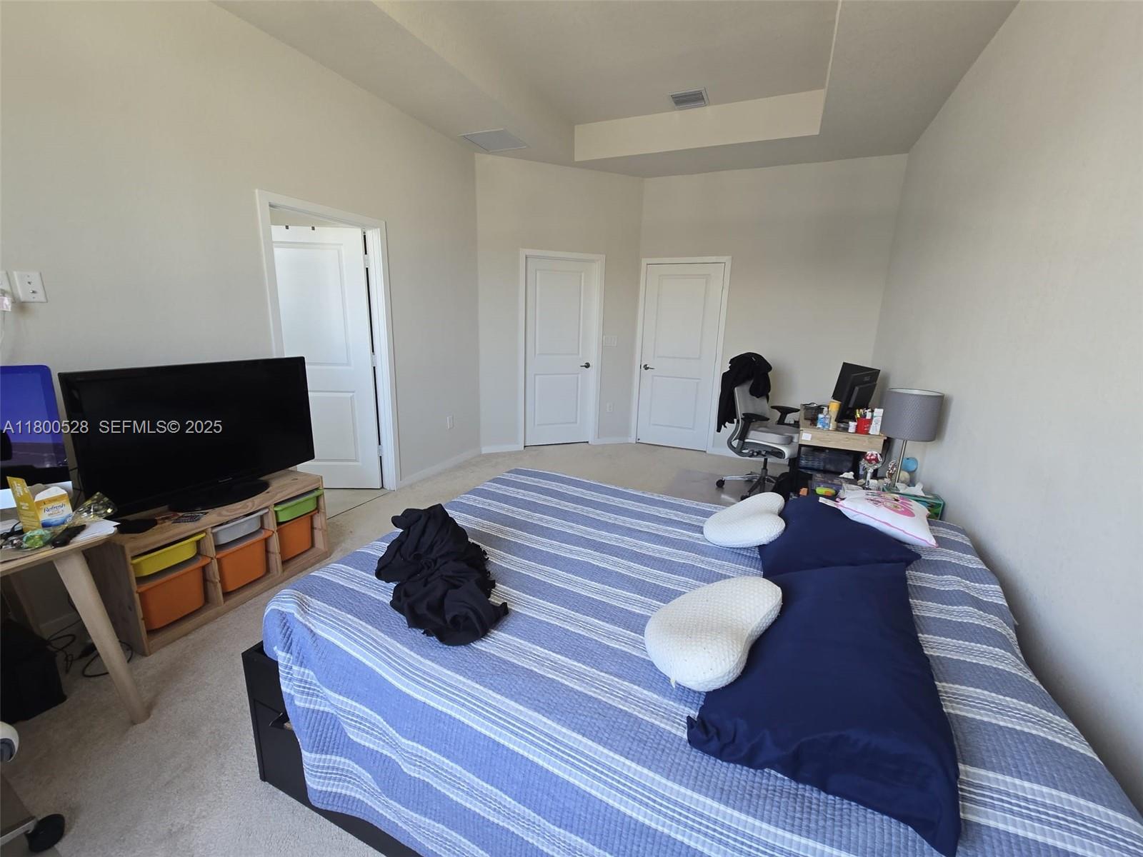 10847 Southwest 232nd Terrace Homestead, FL 33032 - Photo 21 of 29 a living room with furniture and a flat screen tv