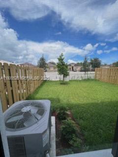 10847 Southwest 232nd Terrace Homestead, FL 33032 - Photo 29 of 29 a backyard of a house with table and chairs