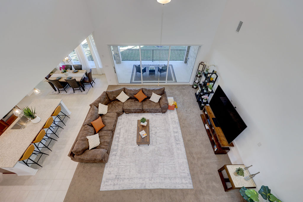 351 Pigeon River Road Kyle, TX 78640 - Photo 30 of 40 Living area featuring a high ceiling and tile patterned flooring