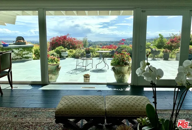 a view of a vase of flowers sitting on a table
