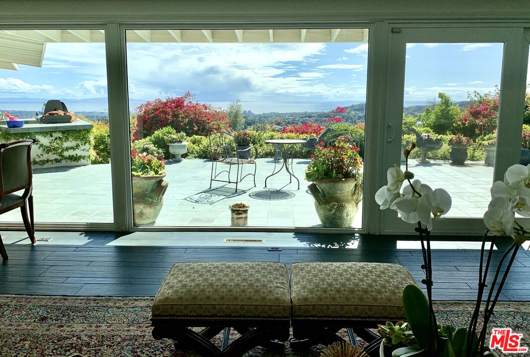12250 Canna Road Los Angeles, CA 90049 - Photo 4 of 7 a view of a vase of flowers sitting on a table