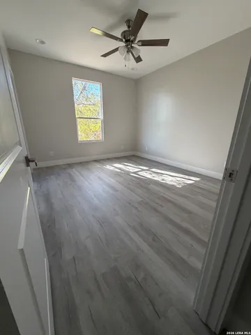 a bathroom with a glass shower door
