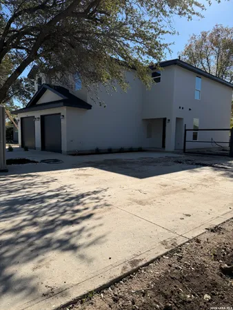 a view of a house with a snow on the road