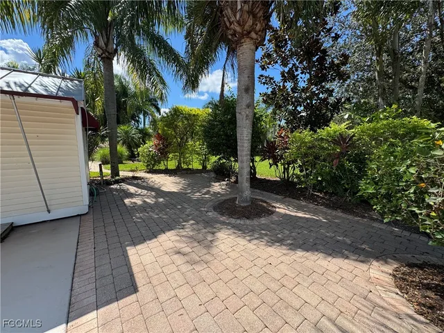 a view of a backyard of the house