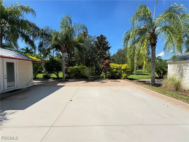 a house with a yard and a garage