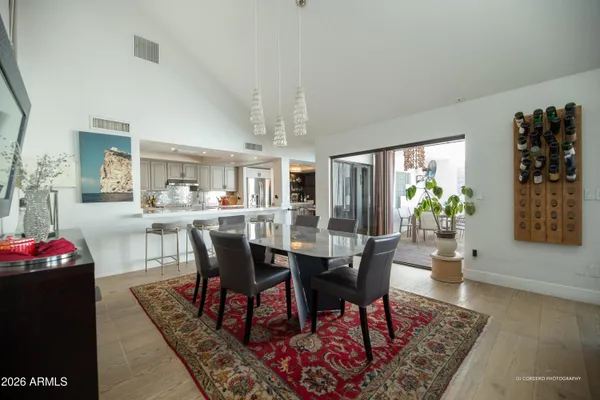 a view of a dining room with furniture and wooden floor