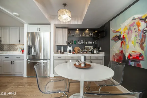 a kitchen with refrigerator and sink