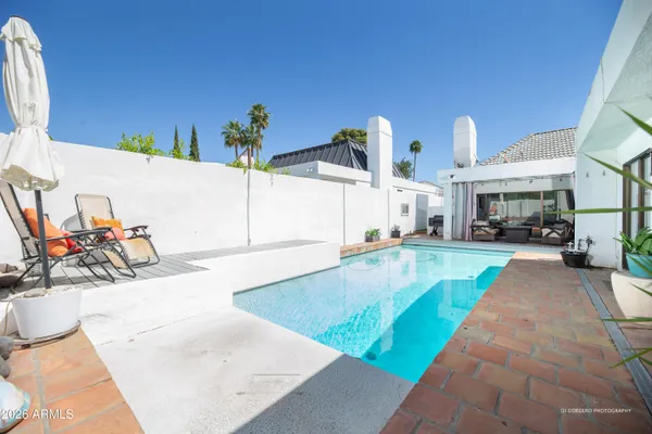 a view of a swimming pool with a patio
