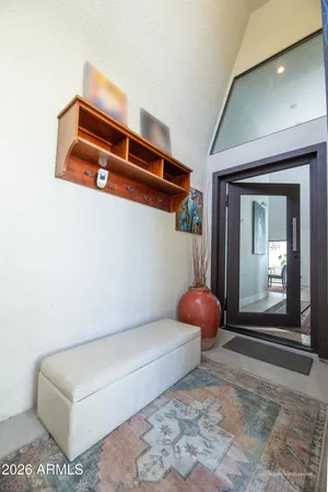 a living room with a couch and dresser