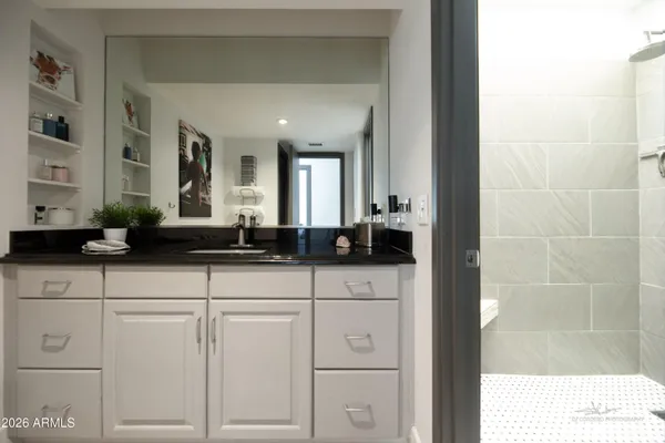 a bathroom with a sink and a mirror