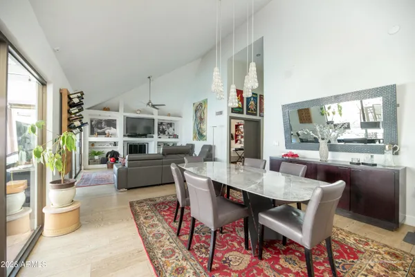 a dining room with furniture and wooden floor