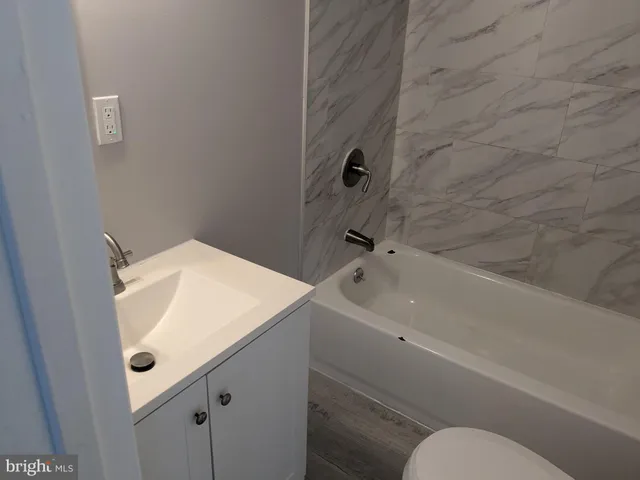 a bathroom with a sink and mirror