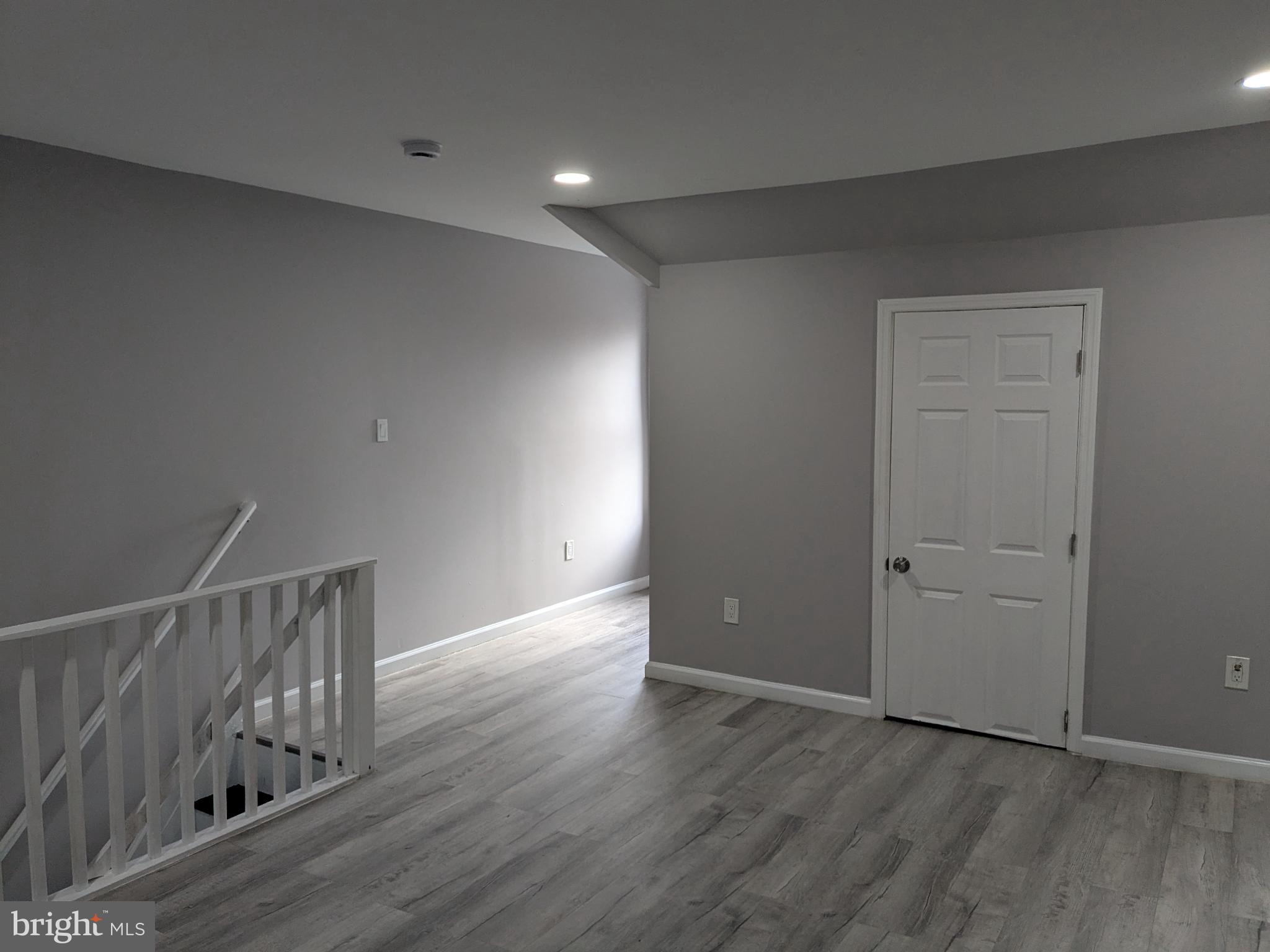 178 178-apt Hanover Street, Unit 2W Trenton, NJ 08618 - Photo 19 of 22 wooden floor in an empty room