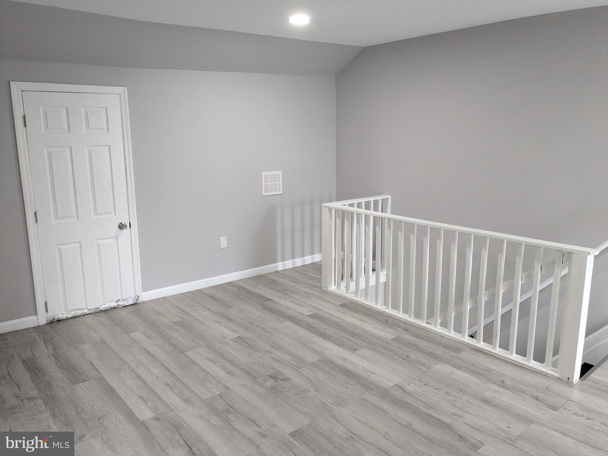 178 178-apt Hanover Street, Unit 2W Trenton, NJ 08618 - Photo 21 of 22 a view of a hallway with wooden floor