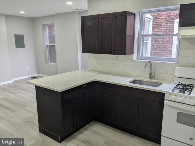 a kitchen with a sink and cabinets