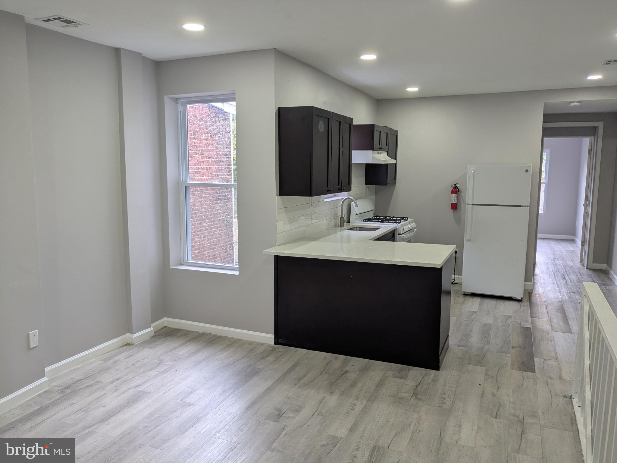 178 178-apt Hanover Street, Unit 2W Trenton, NJ 08618 - Photo 6 of 22 a bathroom with a sink vanity and a mirror