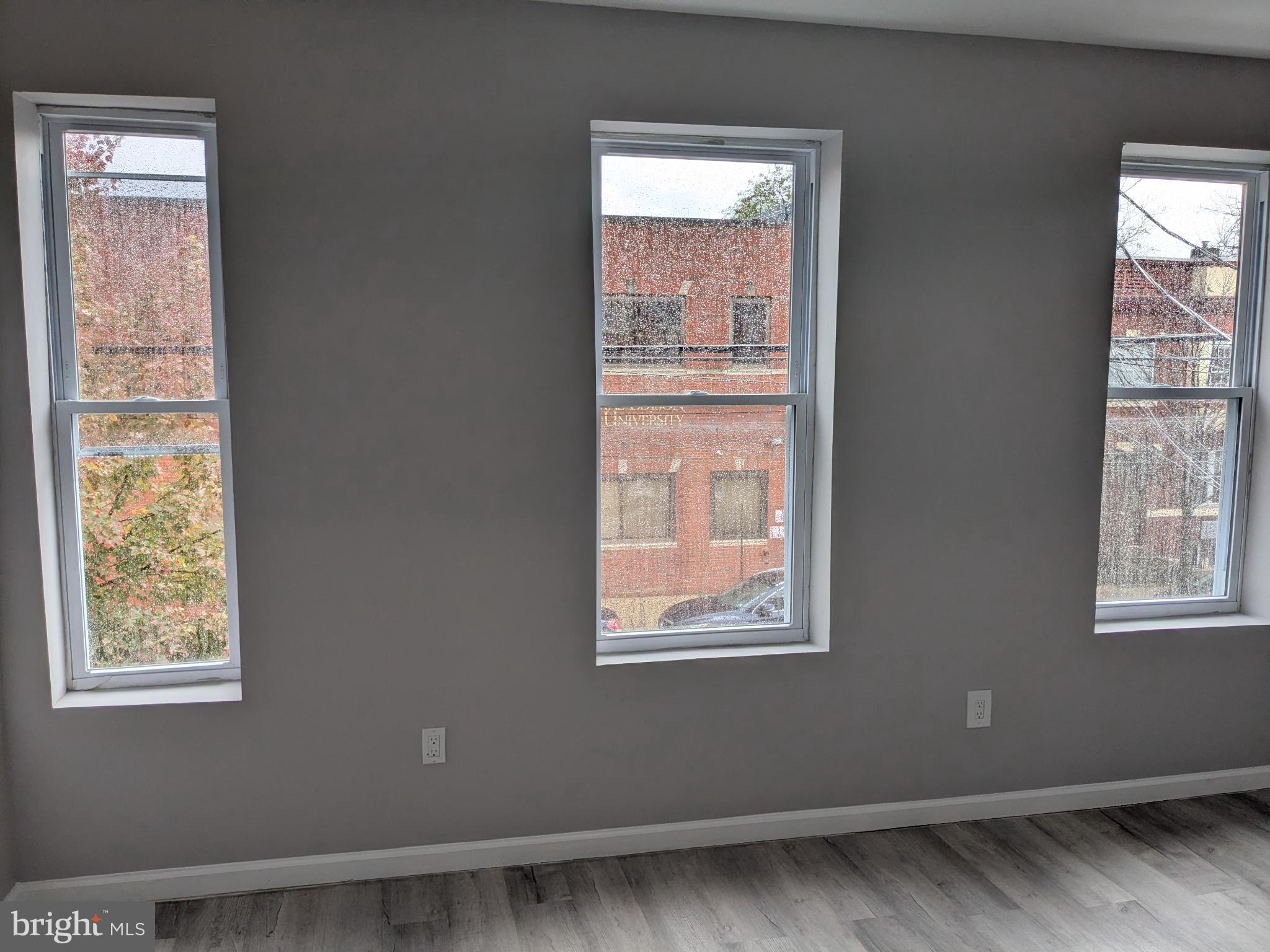 178 178-apt Hanover Street, Unit 2W Trenton, NJ 08618 - Photo 8 of 22 a view of an empty room with a window