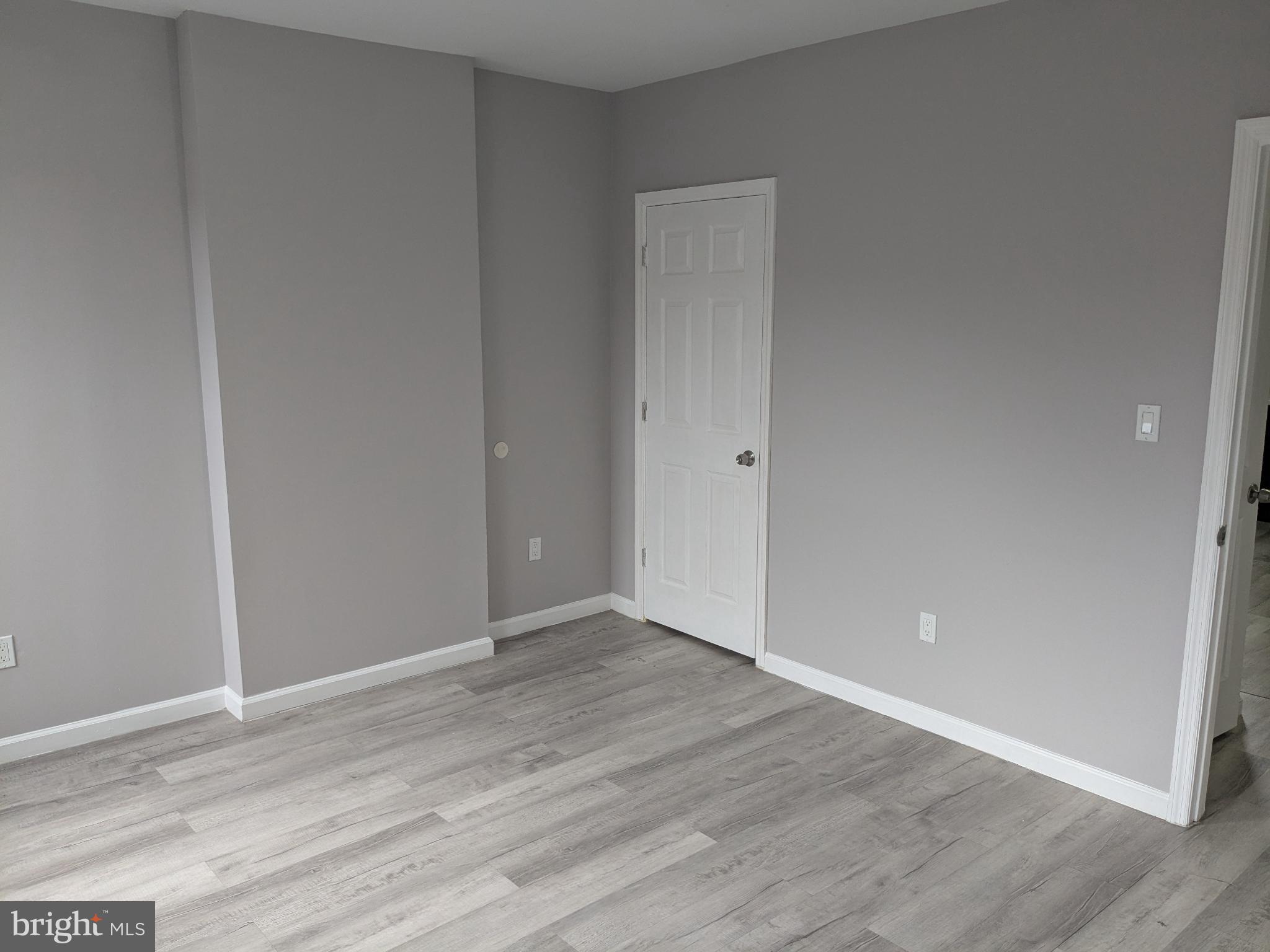 178 178-apt Hanover Street, Unit 2W Trenton, NJ 08618 - Photo 10 of 22 a view of an empty room with wooden floor