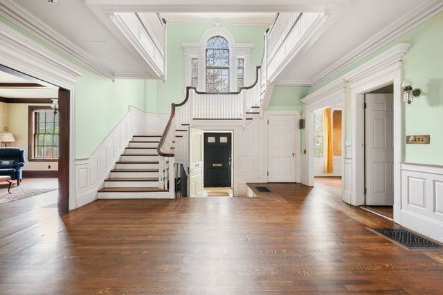 a view of entryway with wooden floor