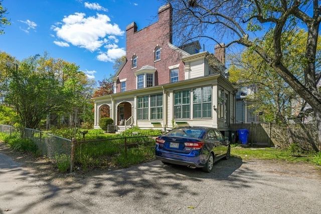 a house view with a sitting space and garden