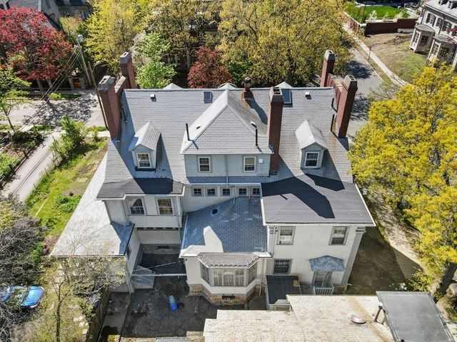 an aerial view of a house with wooden floor