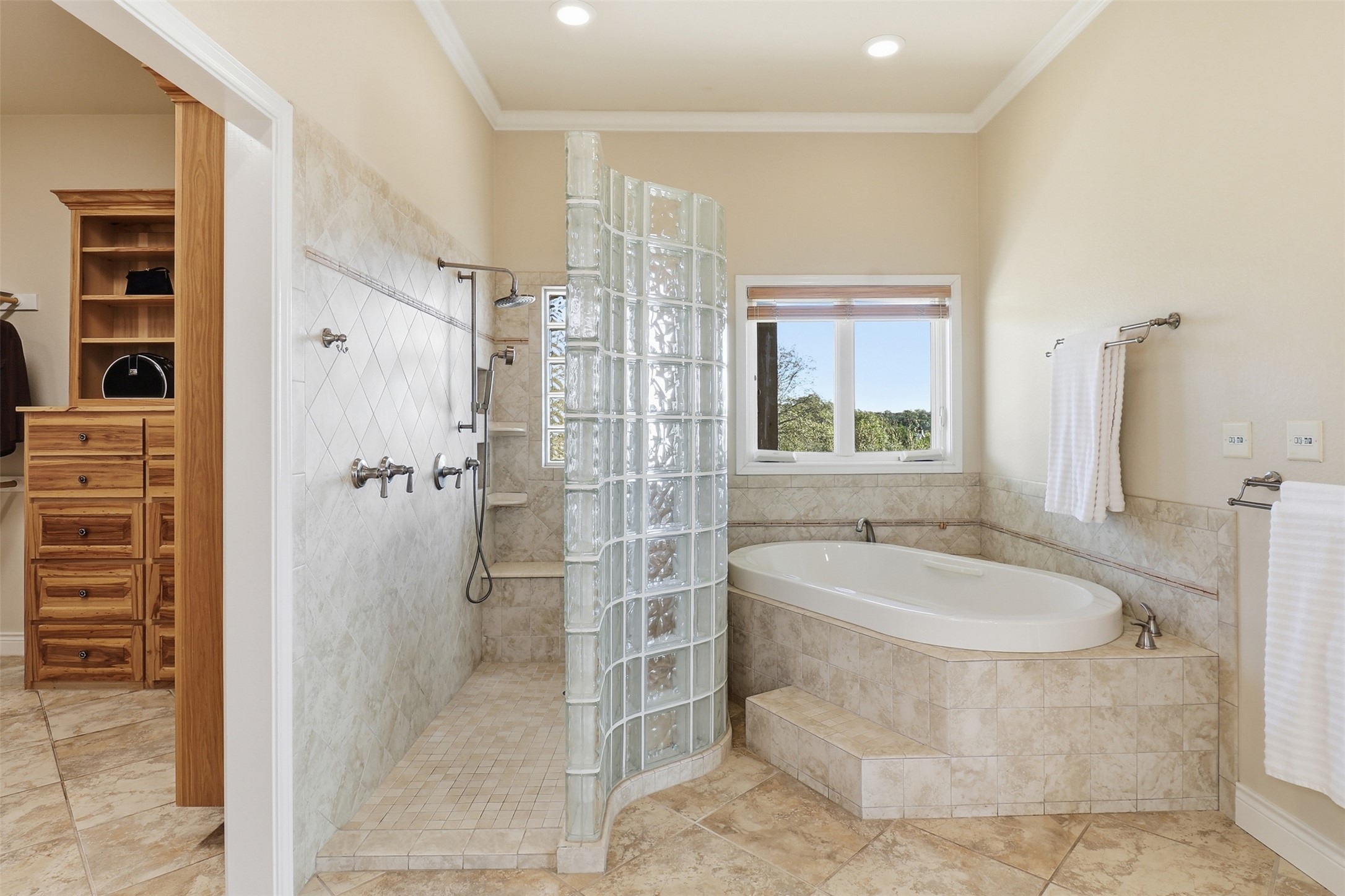 450 Threadgill Ranch Road Burnet, TX 78611 - Photo 11 of 33 a bathroom with a granite countertop shower a sink and a bathtub