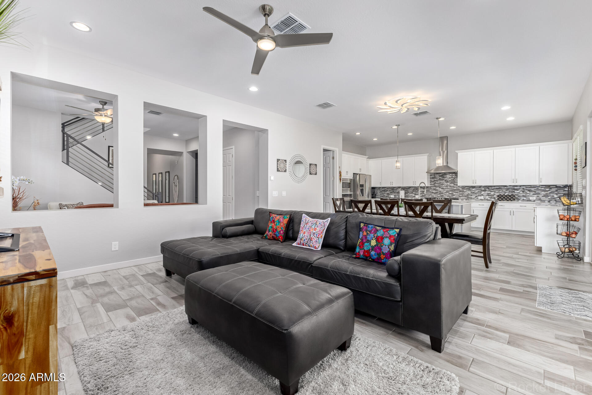 3494 East Spring Wheat Lane Gilbert, AZ 85296 - Photo 11 of 39 a living room with furniture and kitchen view