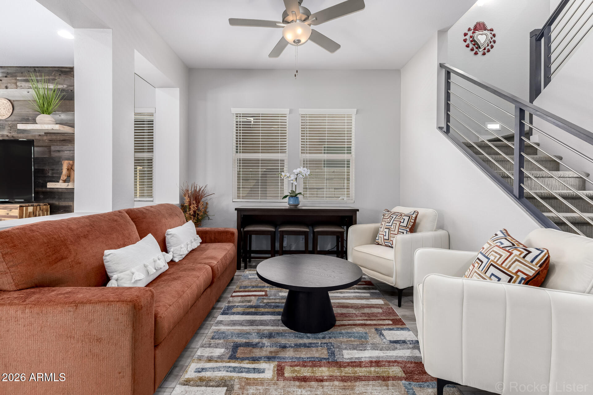 3494 East Spring Wheat Lane Gilbert, AZ 85296 - Photo 13 of 39 a living room with furniture a rug and a large window
