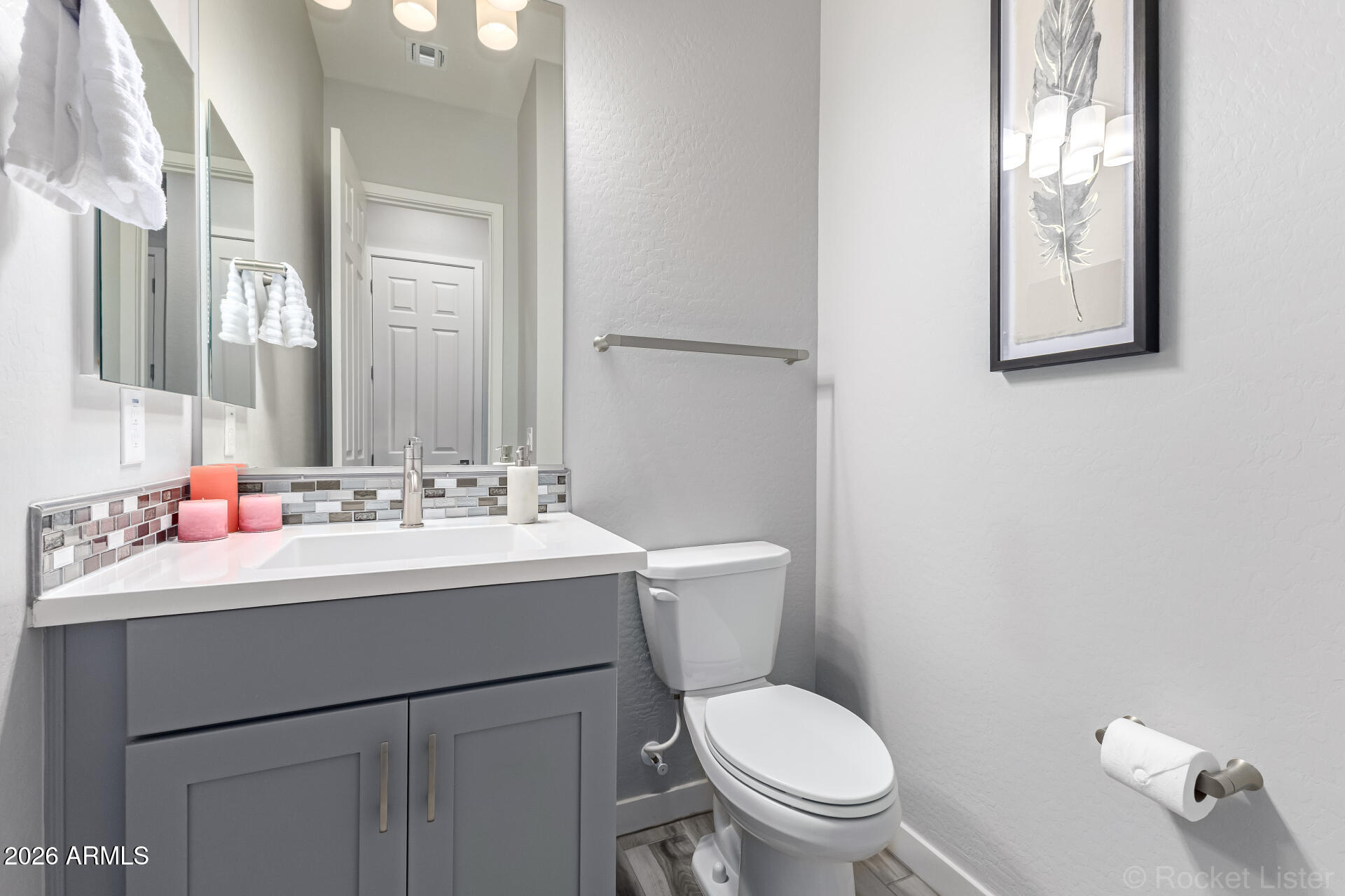 3494 East Spring Wheat Lane Gilbert, AZ 85296 - Photo 15 of 39 a bathroom with a toilet sink and mirror