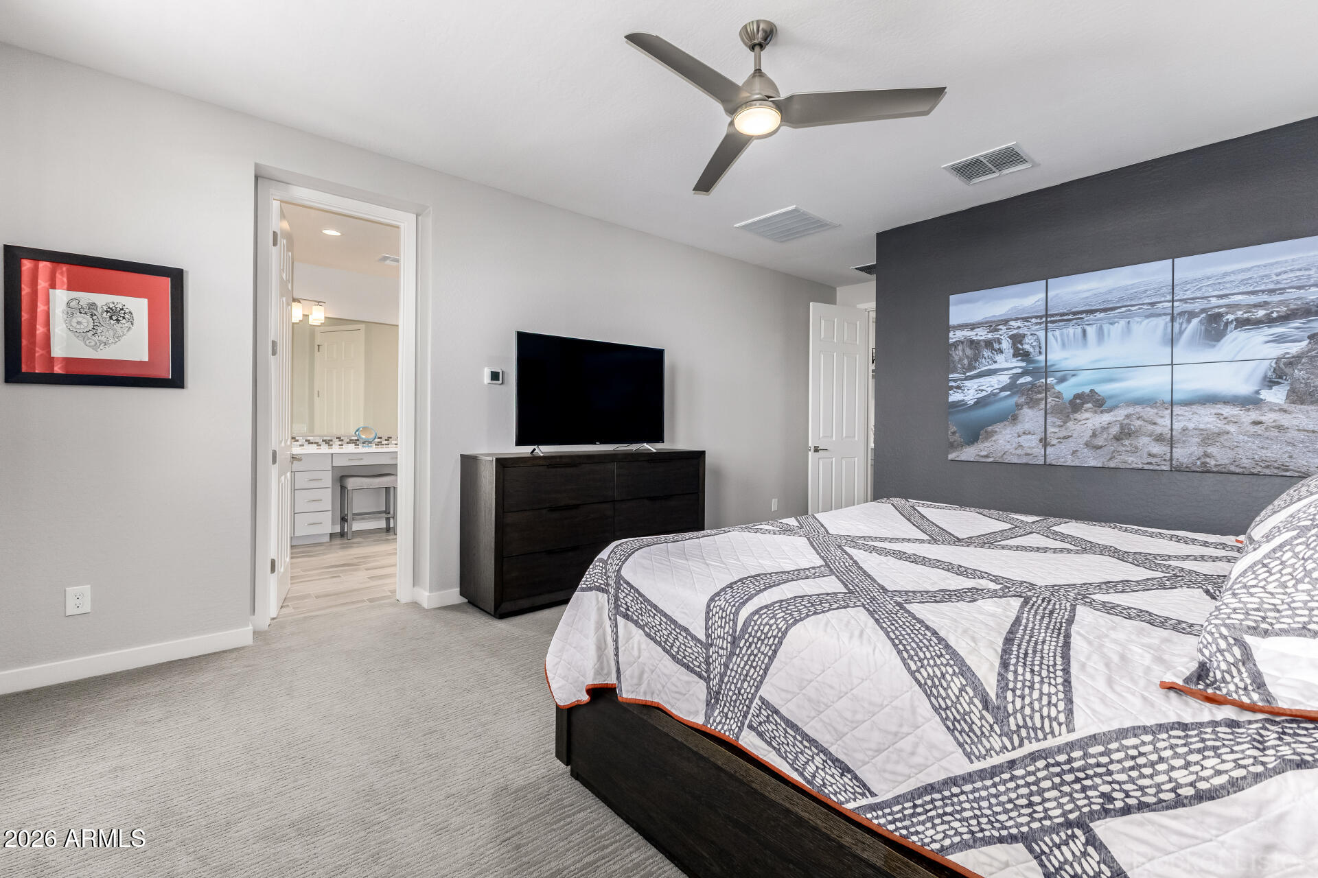 3494 East Spring Wheat Lane Gilbert, AZ 85296 - Photo 20 of 39 a bedroom with a bed and a flat screen tv