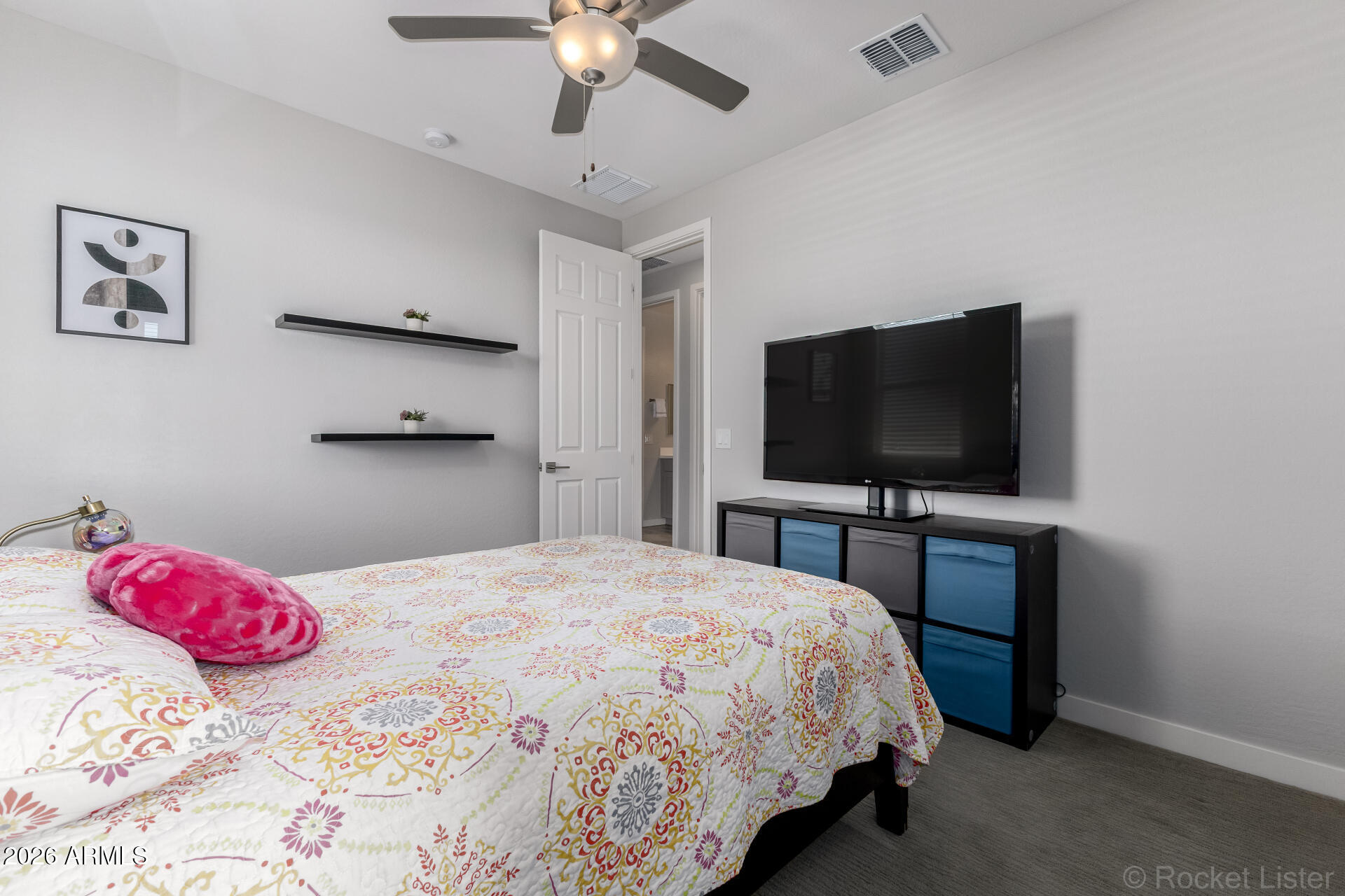 3494 East Spring Wheat Lane Gilbert, AZ 85296 - Photo 25 of 39 a bedroom with a bed and a flat screen tv
