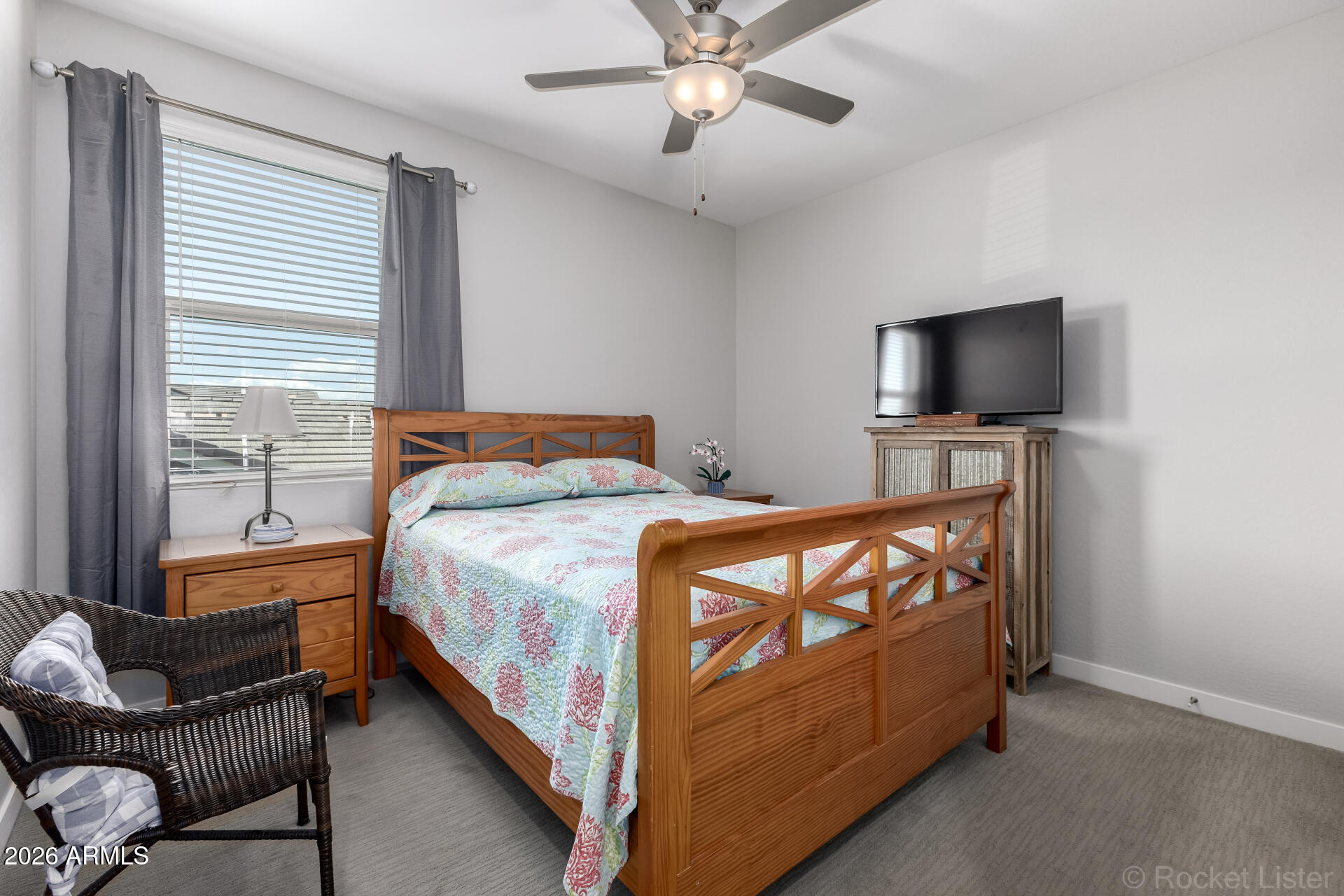 3494 East Spring Wheat Lane Gilbert, AZ 85296 - Photo 26 of 39 a bedroom with a bed couch and a flat tv screen