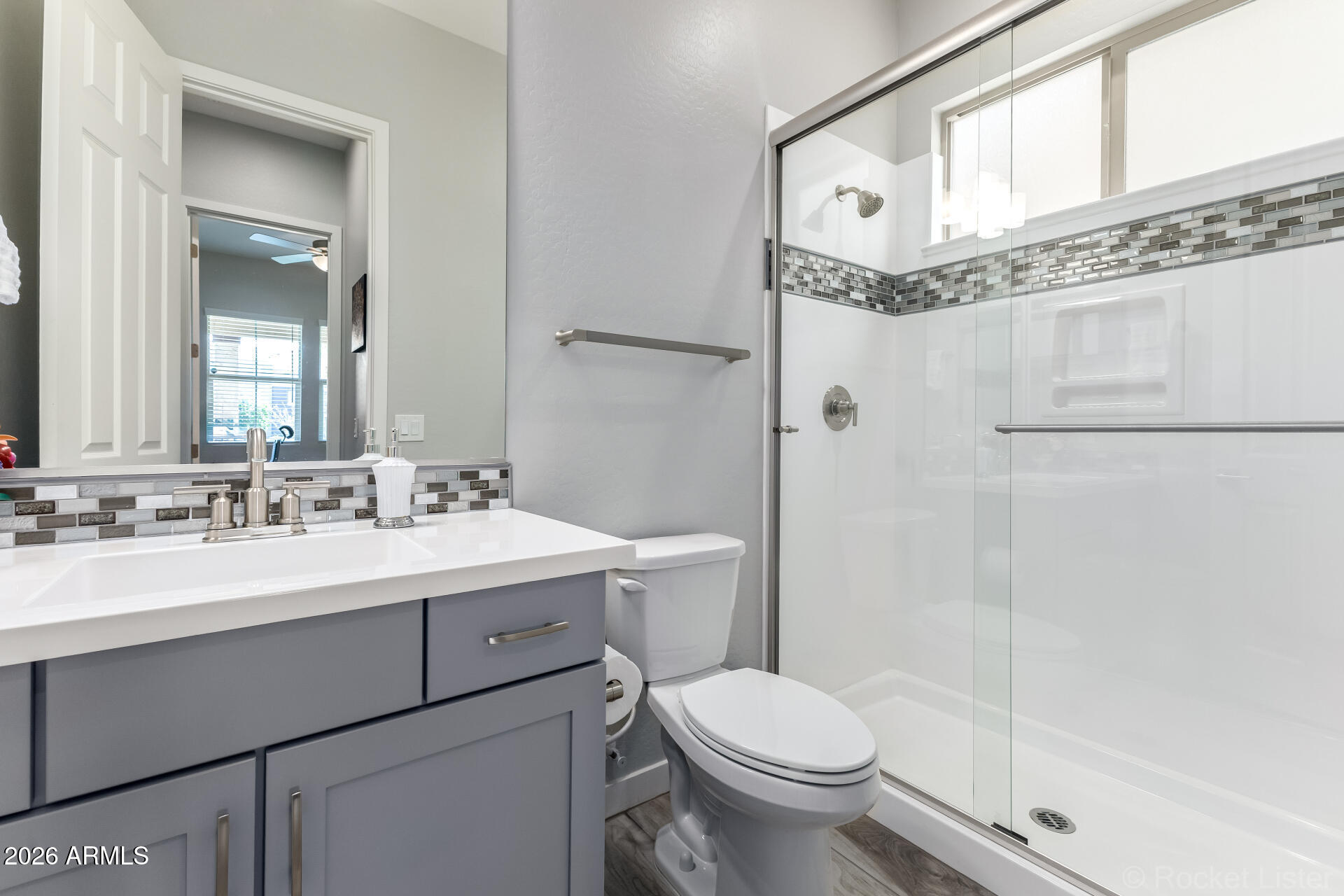 3494 East Spring Wheat Lane Gilbert, AZ 85296 - Photo 28 of 39 a bathroom with a sink a toilet and shower